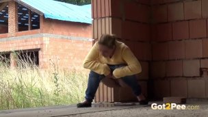 Blonde teen pisses on a building site to relieve pee desperation