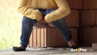 Blonde teen pisses on a building site to relieve pee desperation